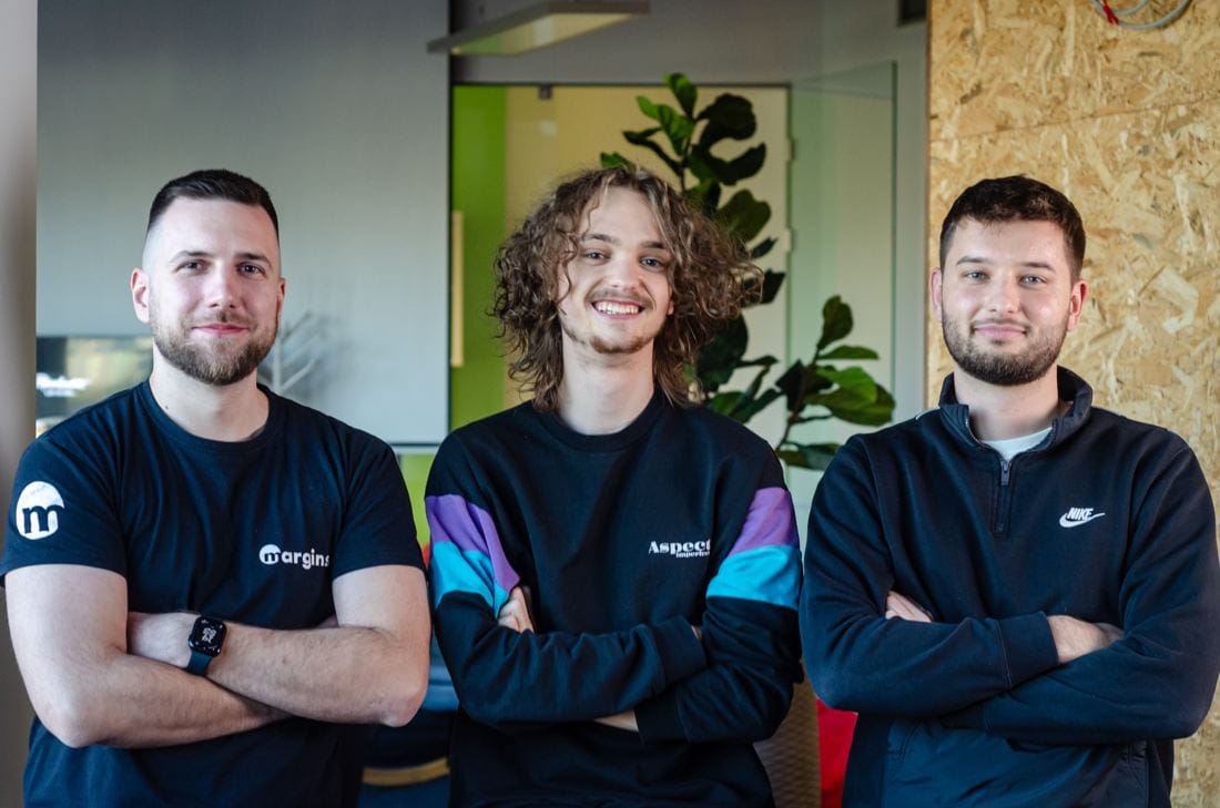 Three Margins engineers smiling with arms crossed